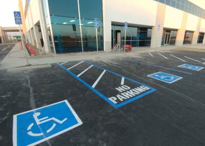 A parking lot with no parking signs painted on it.