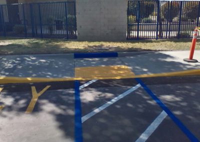 A parking lot with a blue line painted on it.