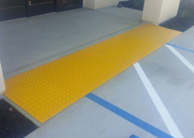 A yellow ramp leading up to a building.