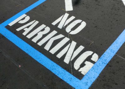 No parking sign painted on a parking lot.