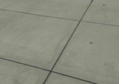 A close up of a concrete sidewalk.