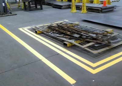 A yellow line on the floor of a warehouse.