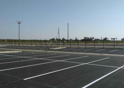 A parking lot with white lines on it.