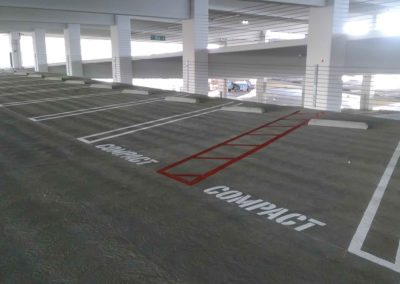 A parking lot with a red line painted on it.