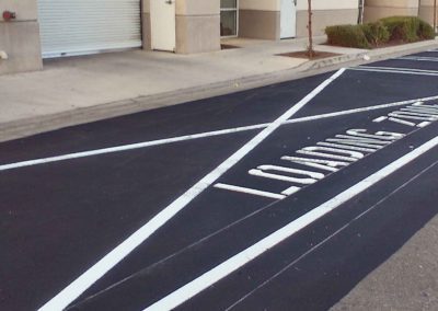 A parking lot with white lines painted on it.